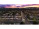 Overhead view of a serene neighborhood street with the Las Vegas Strip illuminated in the background at 3706 Etendre Ct, Las Vegas, NV 89121