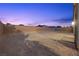 Spacious backyard with desert landscaping and a brick perimeter for privacy at 3706 Etendre Ct, Las Vegas, NV 89121