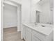 Bright bathroom featuring white cabinets, a modern sink, and an open-concept design at 3706 Etendre Ct, Las Vegas, NV 89121