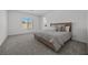 Cozy bedroom with plush carpeting, a comfortable bed, and a serene view from the window at 3706 Etendre Ct, Las Vegas, NV 89121