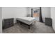 Clean bedroom with two side tables, carpet, and window with dark curtains at 3706 Etendre Ct, Las Vegas, NV 89121