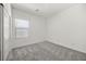 Neutral bedroom with a window, carpet, and closet, offering a cozy space at 3706 Etendre Ct, Las Vegas, NV 89121