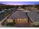 Charming single-Gathering home featuring a three-car garage and landscaped front yard with mature trees and palm trees at 3706 Etendre Ct, Las Vegas, NV 89121