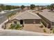 Charming single-Gathering home with brick driveway, mature landscaping, and a spacious three-car garage at 3706 Etendre Ct, Las Vegas, NV 89121