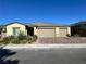 Charming single-story home with a three-car garage and desert landscaping for low maintenance at 3706 Etendre Ct, Las Vegas, NV 89121