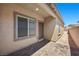 Home exterior featuring a brick walkway, side yard, and neutral stucco at 3706 Etendre Ct, Las Vegas, NV 89121