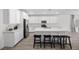 Modern kitchen boasts white cabinets, stainless steel appliances, a large center island, and a spacious design at 3706 Etendre Ct, Las Vegas, NV 89121