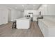 Bright kitchen features white cabinets, stainless appliances, and a large center island at 3706 Etendre Ct, Las Vegas, NV 89121
