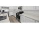 Up close view of kitchen's modern stainless steel oven and white countertops at 3706 Etendre Ct, Las Vegas, NV 89121
