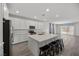 Stylish kitchen features white cabinets, stainless steel appliances, a large center island, and an open layout at 3706 Etendre Ct, Las Vegas, NV 89121