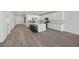 Open-concept kitchen with a large center island, white cabinets, and stainless steel appliances at 3706 Etendre Ct, Las Vegas, NV 89121