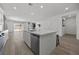 Kitchen island with dishwasher and sink area overlooking the open living area at 3706 Etendre Ct, Las Vegas, NV 89121