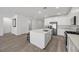 Open kitchen features white cabinetry, a large island, and stainless steel appliances at 3706 Etendre Ct, Las Vegas, NV 89121