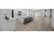 Spacious kitchen featuring a large center island with seating, white cabinets, and stainless steel appliances at 3706 Etendre Ct, Las Vegas, NV 89121