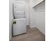 Convenient laundry area with stackable washer and dryer unit and storage space at 3706 Etendre Ct, Las Vegas, NV 89121