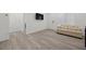 Bright living room features stylish wood-look flooring, neutral colors, and modern accents at 3706 Etendre Ct, Las Vegas, NV 89121
