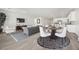 Bright living room featuring modern furnishings and an open floor plan leading into the kitchen at 3706 Etendre Ct, Las Vegas, NV 89121