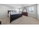 Bedroom boasts neutral paint, shutters on the windows, carpet and a dark wood dresser at 3854 Stadium Ave, Las Vegas, NV 89120