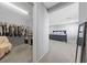 View from bedroom to an adjacent large walk-in closet with shelving and hanging racks at 3854 Stadium Ave, Las Vegas, NV 89120