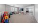 Spacious bonus room with neutral carpet, ample natural light, and plenty of room for entertaining at 3854 Stadium Ave, Las Vegas, NV 89120