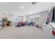 Expansive bonus room with multiple windows, neutral carpet, and versatile space for various activities at 3854 Stadium Ave, Las Vegas, NV 89120