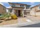 Inviting two-story home featuring a well-manicured yard and covered entryway at 3854 Stadium Ave, Las Vegas, NV 89120