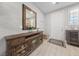 Welcoming foyer features a console table, decorative mirror, and tiled flooring, creating an inviting entrance at 3854 Stadium Ave, Las Vegas, NV 89120