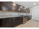 Well-equipped kitchen featuring sleek dark cabinets and stainless steel appliances at 3854 Stadium Ave, Las Vegas, NV 89120