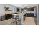 Modern kitchen with dark cabinetry, granite countertops, and stainless steel appliances at 3854 Stadium Ave, Las Vegas, NV 89120
