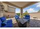 Cozy covered patio with comfortable seating and a stone-paved floor at 3854 Stadium Ave, Las Vegas, NV 89120