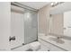 Bathroom with shower stall, toilet, granite countertop, and ample lighting at 3930 University Center Dr # 603, Las Vegas, NV 89119