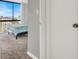 Bright bedroom features city views from a large window and neutral carpet at 3930 University Center Dr # 603, Las Vegas, NV 89119