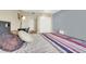 The bedroom features a large closet, gray accent wall, and patterned duvet at 3930 University Center Dr # 603, Las Vegas, NV 89119
