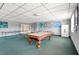 This game room has a pool table, ping pong table, seating, and modern decor at 3930 University Center Dr # 603, Las Vegas, NV 89119