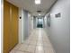 Hallway featuring neutral walls, tiled floor, and unit number sign at 3930 University Center Dr # 603, Las Vegas, NV 89119