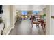 Open concept living room and dining area, complemented by large windows showcasing city views at 3930 University Center Dr # 603, Las Vegas, NV 89119