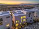 Aerial view of modern homes reveals a beautiful cityscape and mountain range backdrop at 414 Tranquil Peak Ct, Henderson, NV 89012