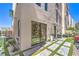 Stylish backyard featuring pavers, grass, built in landscaping and an outdoor grill at 414 Tranquil Peak Ct, Henderson, NV 89012
