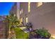 This backyard features a stone paver path, a barbecue grill, and artificial turf at 414 Tranquil Peak Ct, Henderson, NV 89012