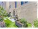 Backyard with grass between the paver stones, a built in grill, and a planter at 414 Tranquil Peak Ct, Henderson, NV 89012