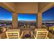 Balcony featuring seating with stunning city views at night at 414 Tranquil Peak Ct, Henderson, NV 89012