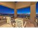 Balcony featuring seating with stunning city views at night at 414 Tranquil Peak Ct, Henderson, NV 89012
