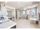 Bright, spacious bathroom features dual sinks, a modern bathtub, and a large walk-in shower at 414 Tranquil Peak Ct, Henderson, NV 89012
