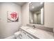Modern bathroom with a sleek vanity, contemporary fixtures, and artistic decor at 414 Tranquil Peak Ct, Henderson, NV 89012