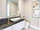 Modern bathroom with a sleek countertop, vessel sink, and contemporary fixtures at 414 Tranquil Peak Ct, Henderson, NV 89012
