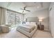 Bright bedroom featuring a modern bed and a sliding glass door to the outdoor area at 414 Tranquil Peak Ct, Henderson, NV 89012