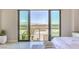 Bedroom view showcases city views, sliding glass doors, and modern decor at 414 Tranquil Peak Ct, Henderson, NV 89012