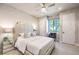 Inviting bedroom featuring a comfortable bed, elegant nightstands, and a window with a view at 414 Tranquil Peak Ct, Henderson, NV 89012