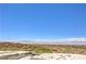 Panoramic view of the city and mountains, overlooking lush golf course and rooftops at 414 Tranquil Peak Ct, Henderson, NV 89012