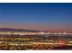 Breathtaking panoramic city skyline view at night with bright lights at 414 Tranquil Peak Ct, Henderson, NV 89012